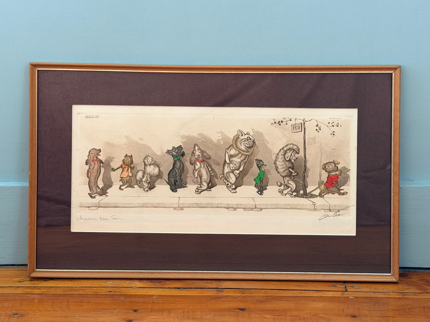 Framed illustration of cartoon characters on a wooden floor with a blue wall background