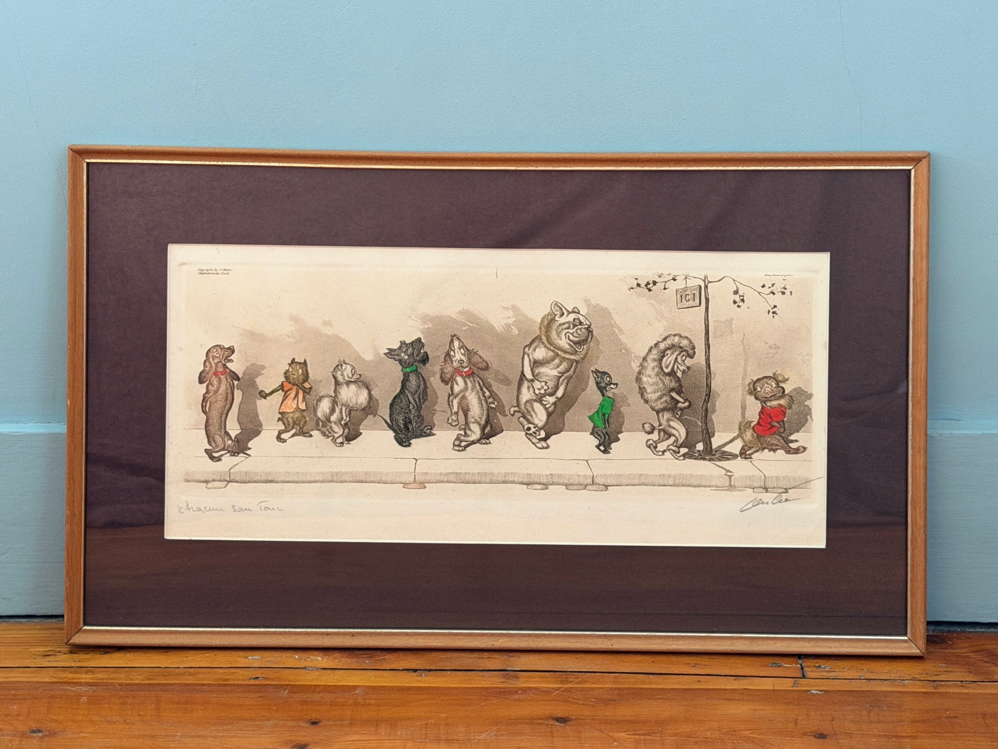 Framed illustration of cartoon characters on a wooden floor with a blue wall background