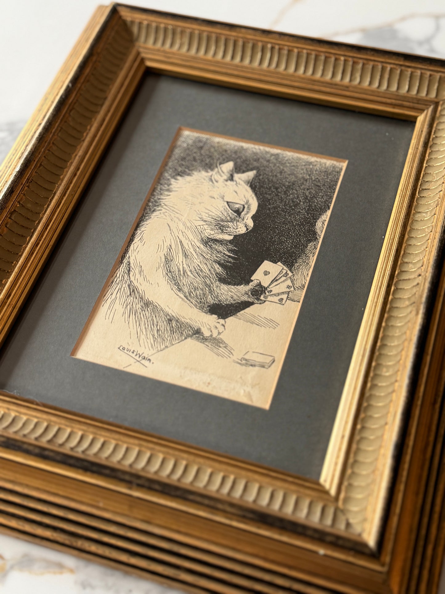 Framed print ‘Cat Playing Cards’ by Louis Wain | 1919