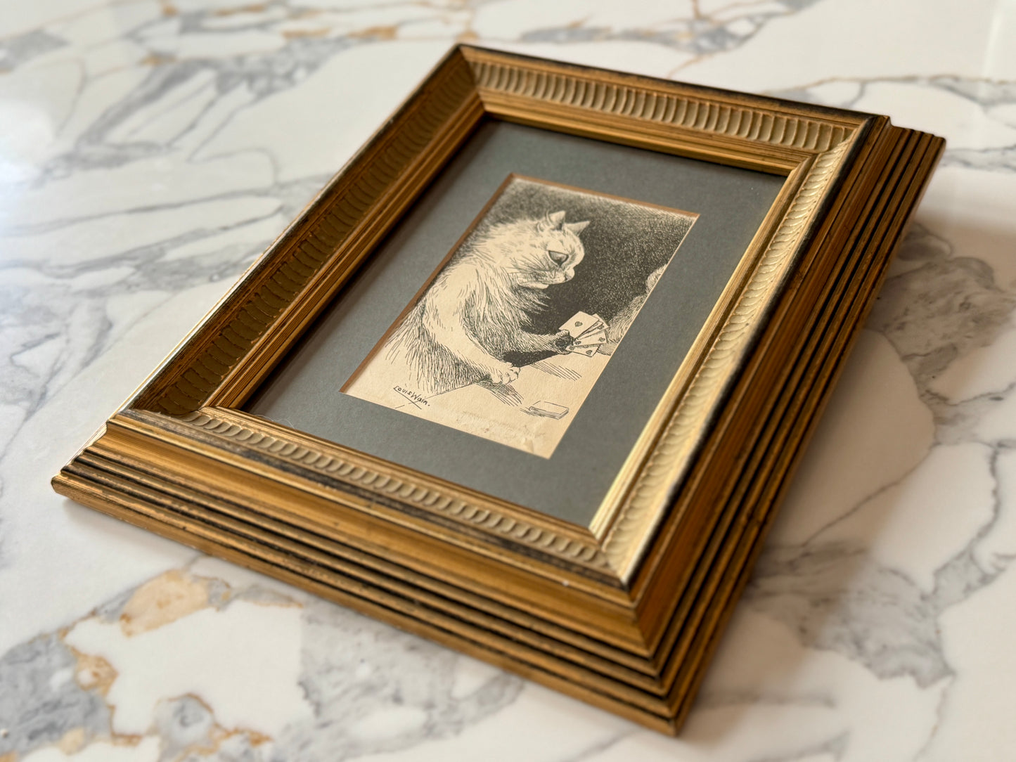 Framed print ‘Cat Playing Cards’ by Louis Wain | 1919