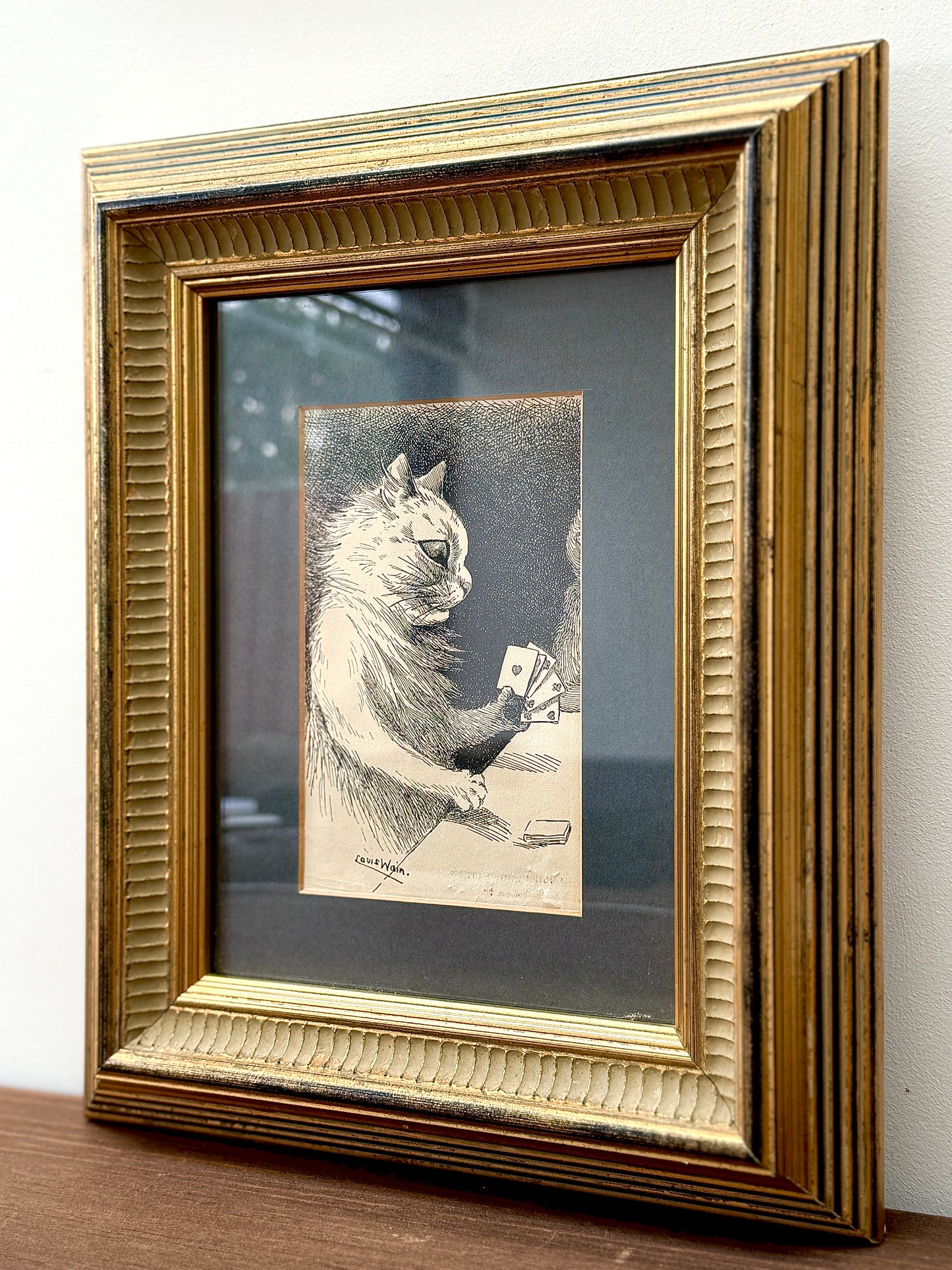 Framed print ‘Cat Playing Cards’ by Louis Wain | 1919