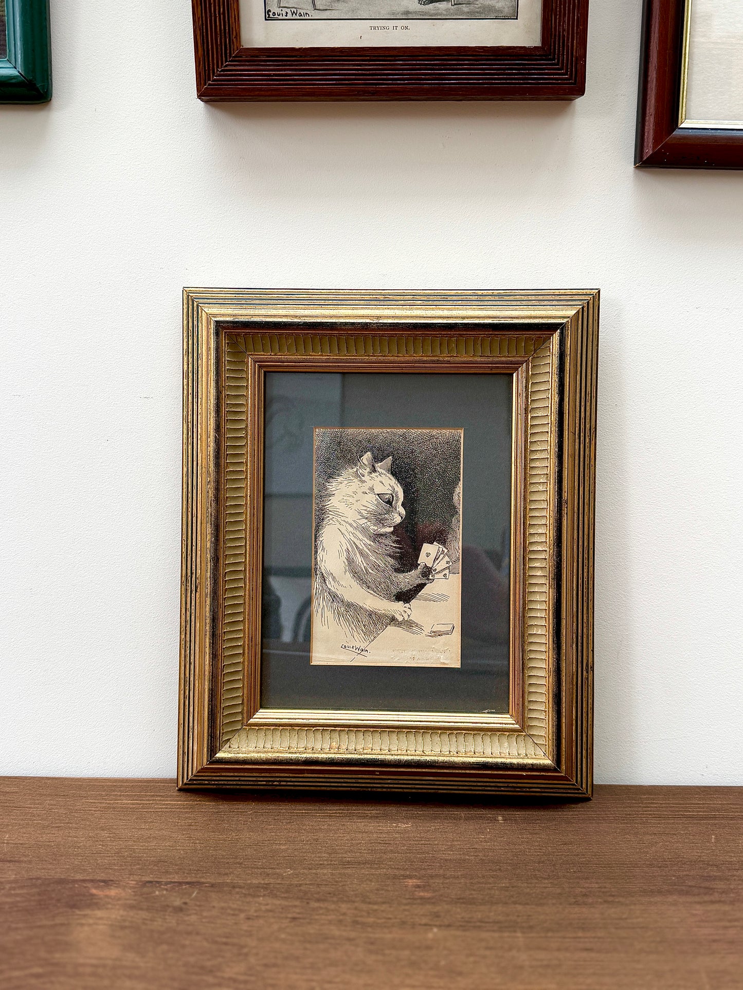 Framed print ‘Cat Playing Cards’ by Louis Wain | 1919