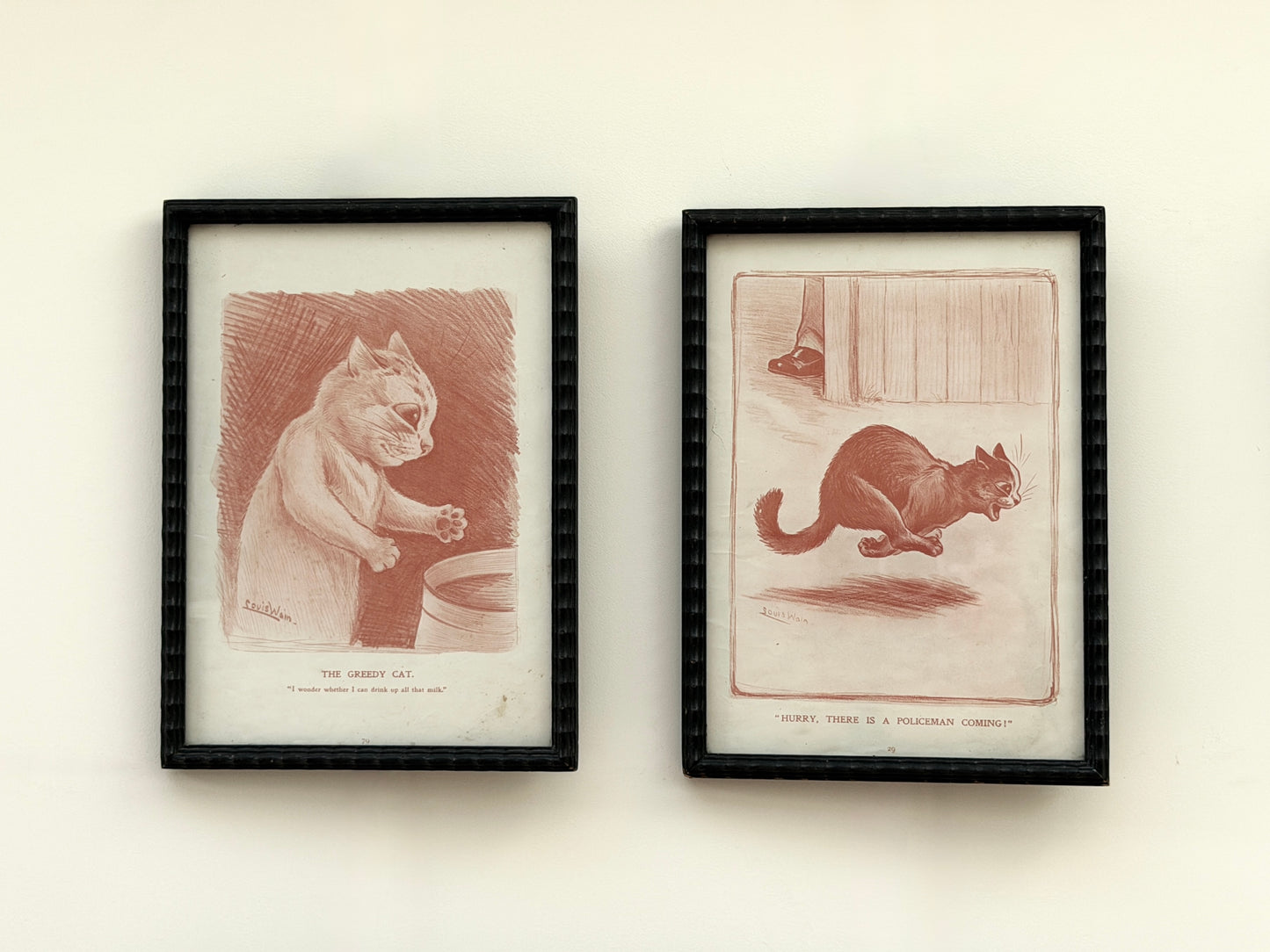 Pair of Antique Louis Wain Cat Prints in Black Wooden Frames, Early 20th Century