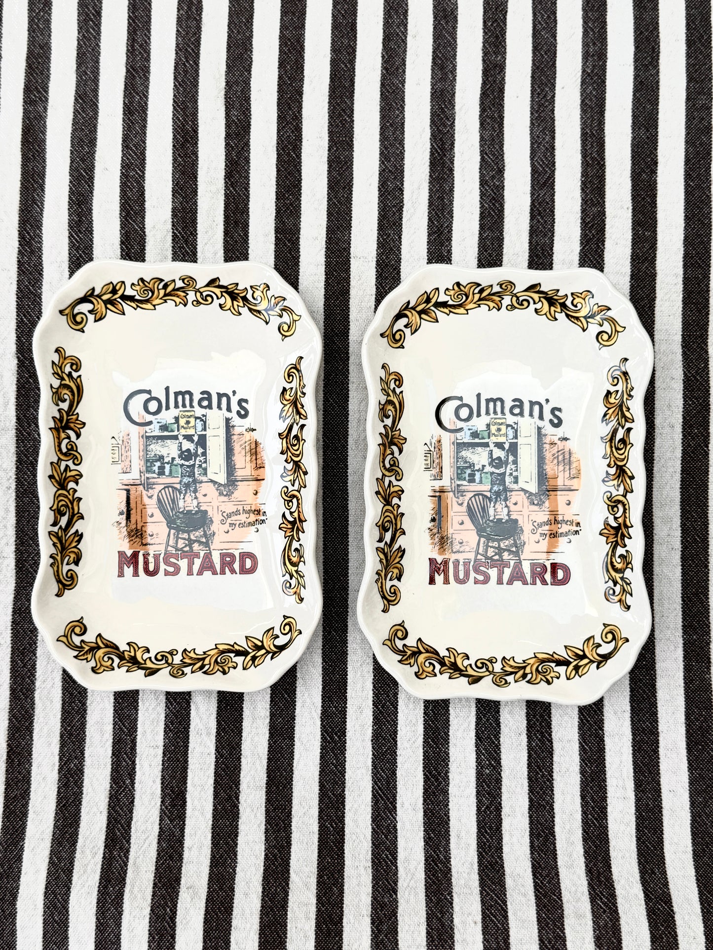 Pair of vintage Lord Nelson Pottery Colman’s Mustard advertising dishes with scalloped edges.
