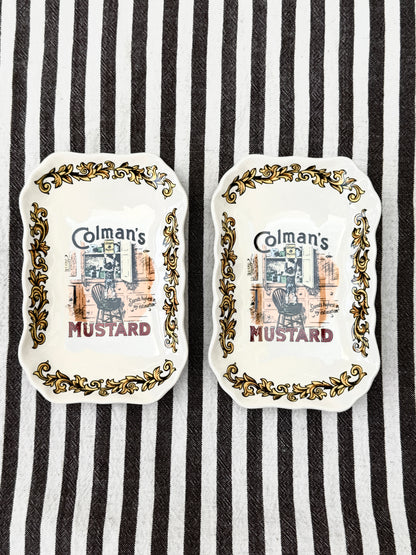 Pair of vintage Lord Nelson Pottery Colman’s Mustard advertising dishes with scalloped edges.