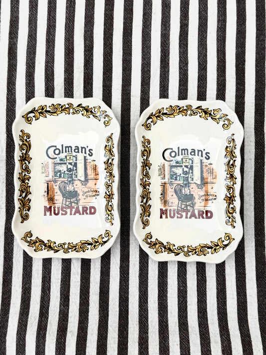 Pair of vintage Lord Nelson Pottery Colman’s Mustard advertising dishes with scalloped edges.